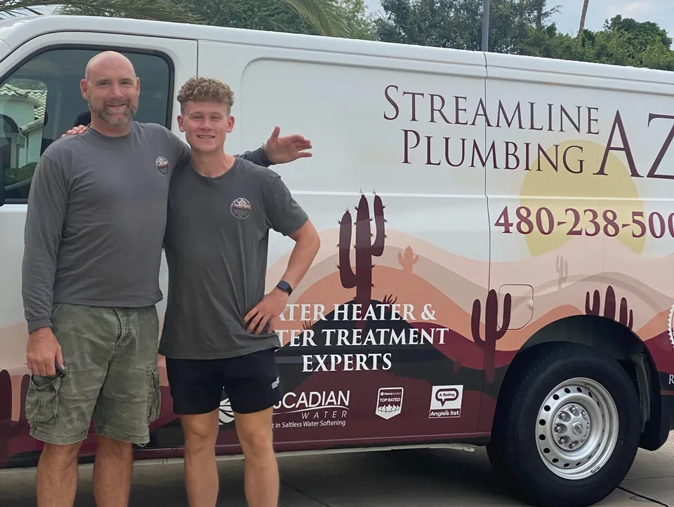 Rich Woyak, owner of Streamline Plumbing AZ, beside a Streamline service van
